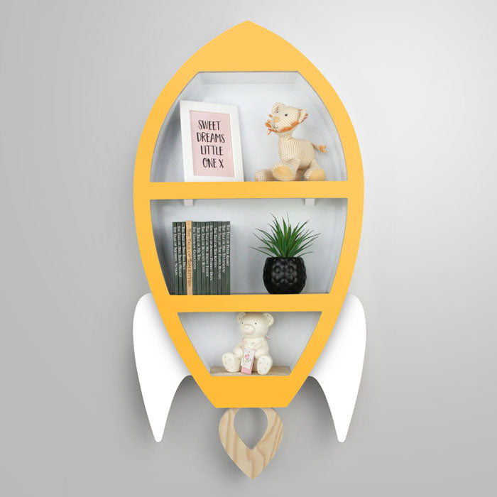 Rocket shaped nursery shelf in yellow and white.