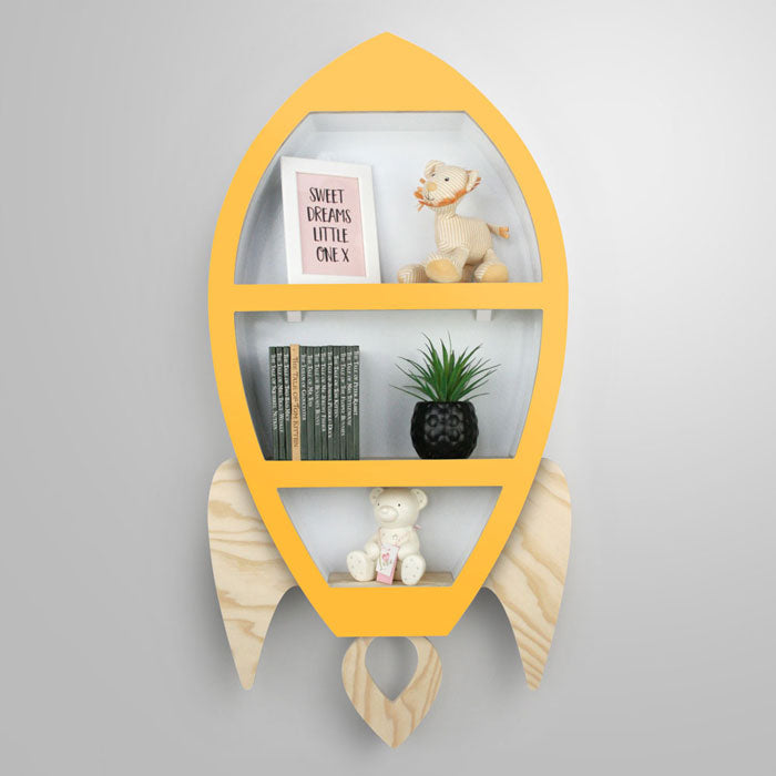 Rocket shaped nursery shelf in yellow and wood.