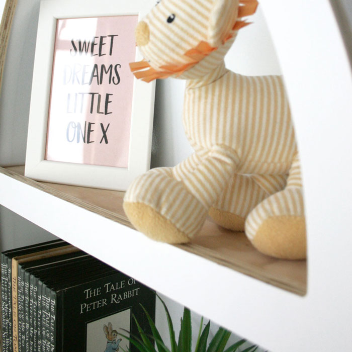 Rocket shaped nursery shelf in white inner shelf.