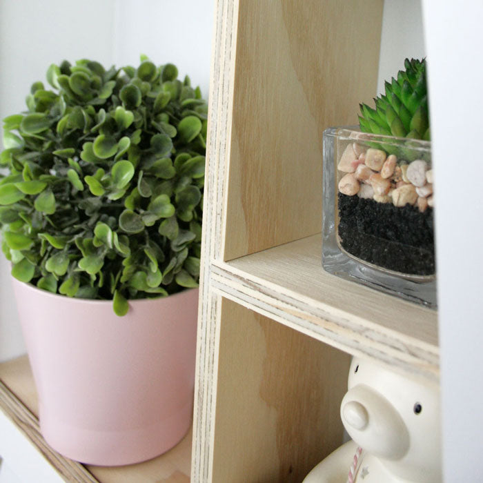 Giraffe shaped nursery shelf in white inner detail.