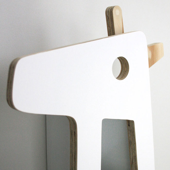 Giraffe shaped nursery shelf in white head detail.