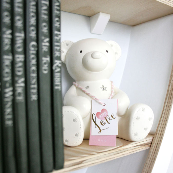 Balloon shaped nursery shelves in white inner shelf detail.