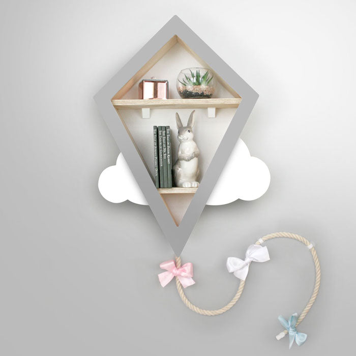 Kite shaped nursery shelf in grey and white.