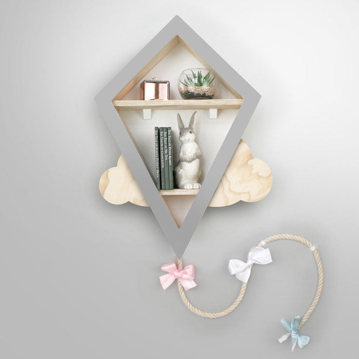 Kite shaped nursery shelf in grey and wood.