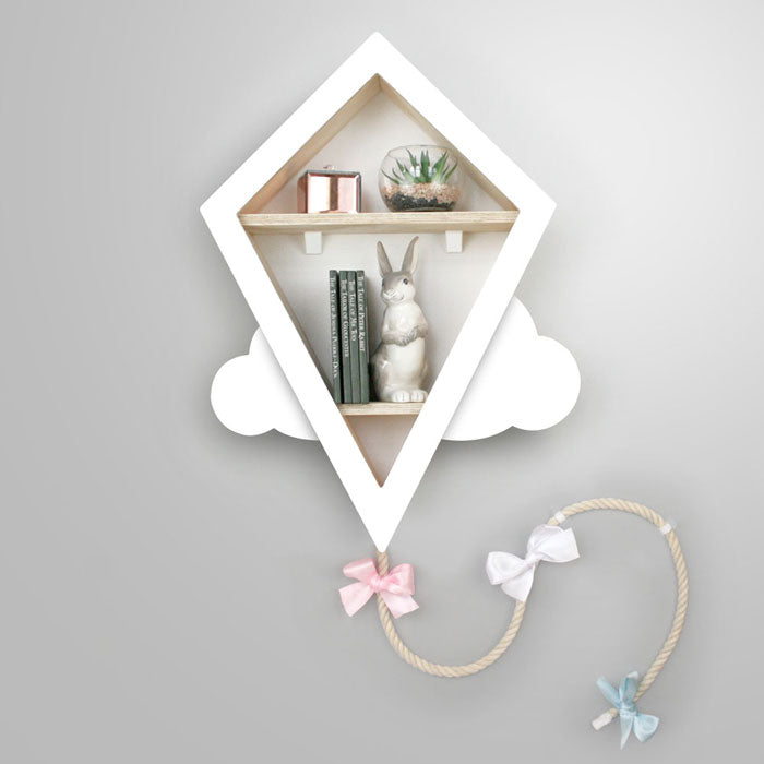 Kite shaped nursery shelf in white and white.