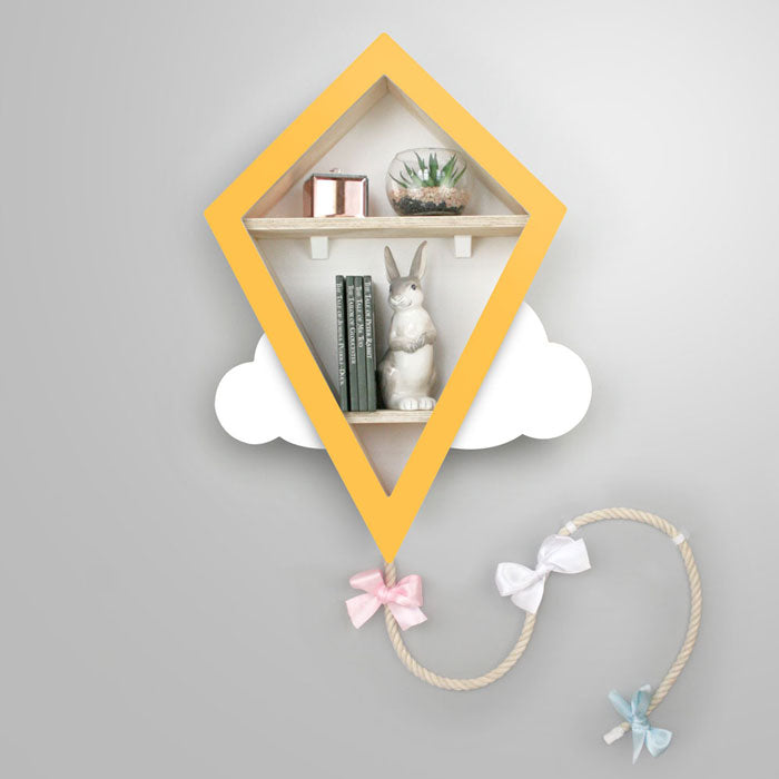 Kite shaped nursery shelf in yellow and white.