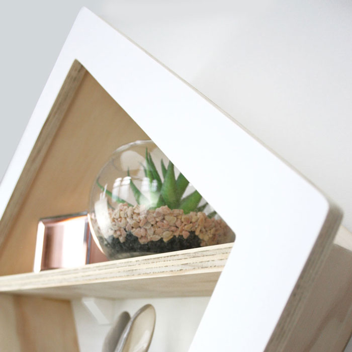 Kite shaped nursery shelf in white side aspect detail.