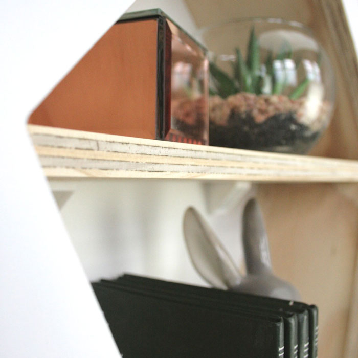 Kite shaped nursery shelf in white inner shelf detail.