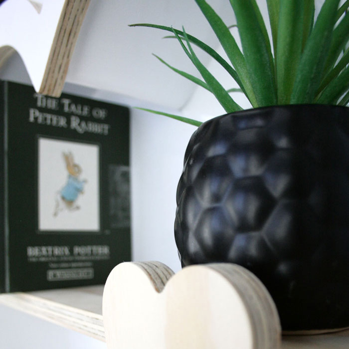 Heart shaped nursery shelf in white inner detail.