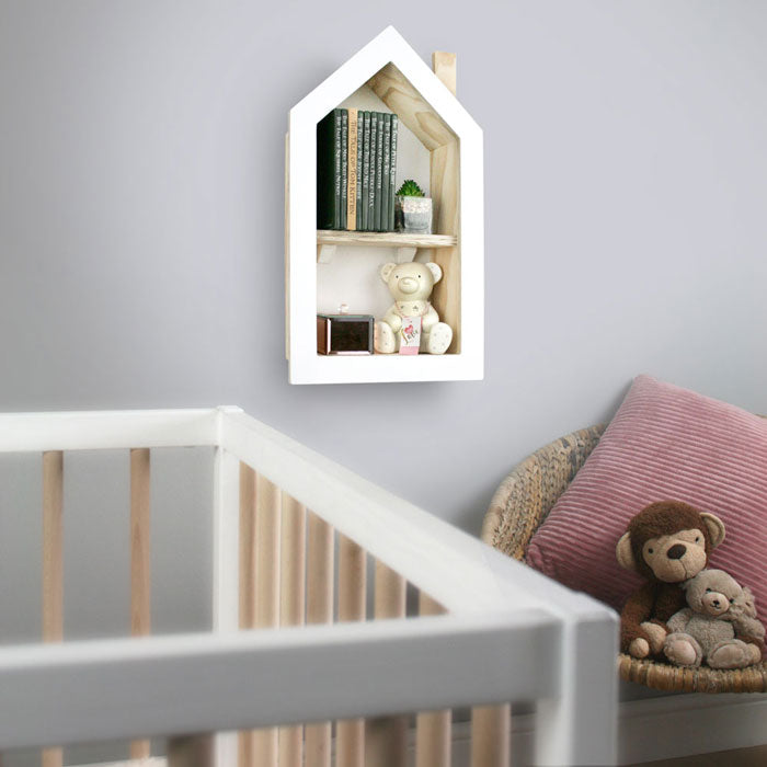 House shaped nursery shelf in white wall mounted in babies nursery setting.