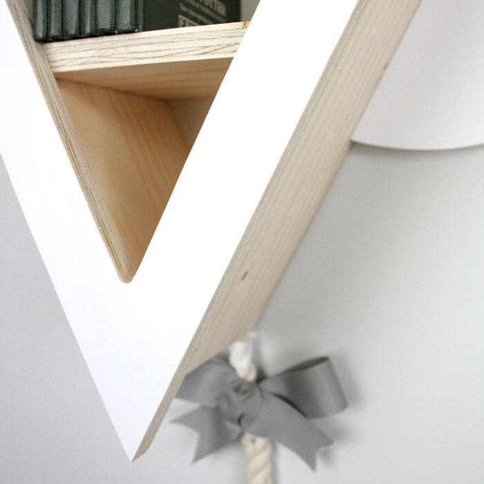 Kite shaped nursery shelf in white bottom aspect detail.