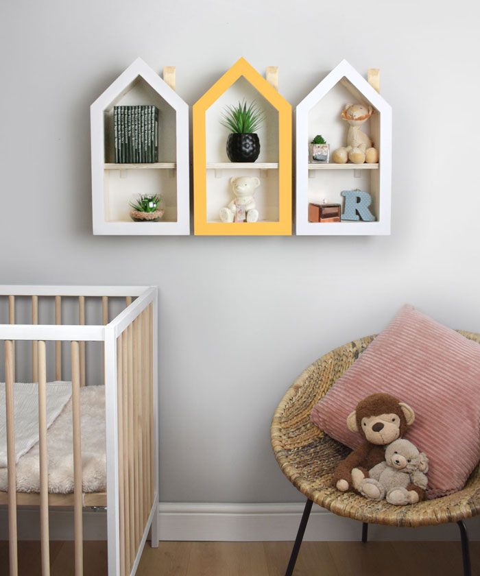 House shaped nursery shelf in white multiple wall mounted.