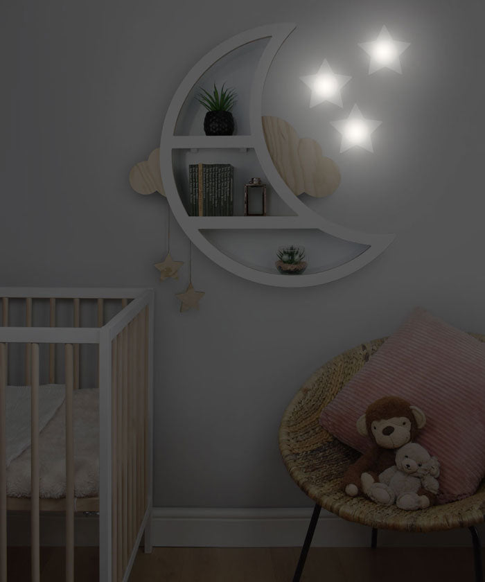 Star wall lights illuminated in nursery room setting.