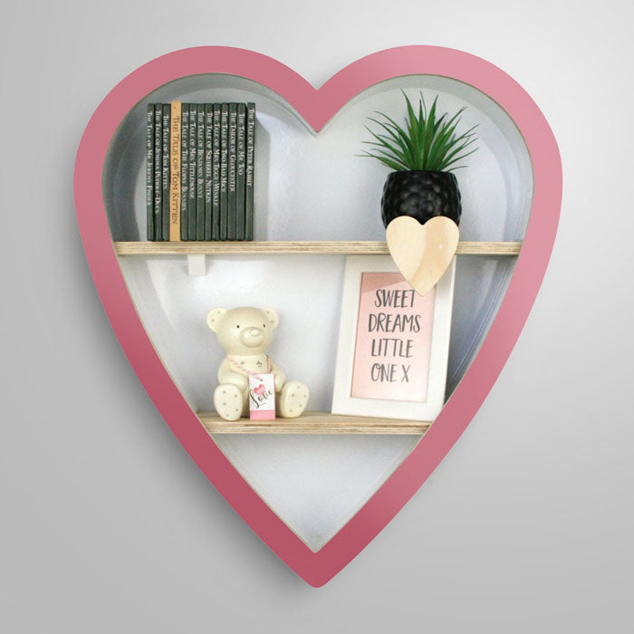 Heart shaped nursery shelf in pink.