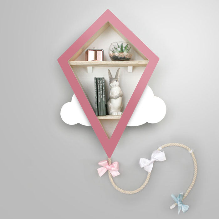Kite shaped nursery shelf in pink and white.