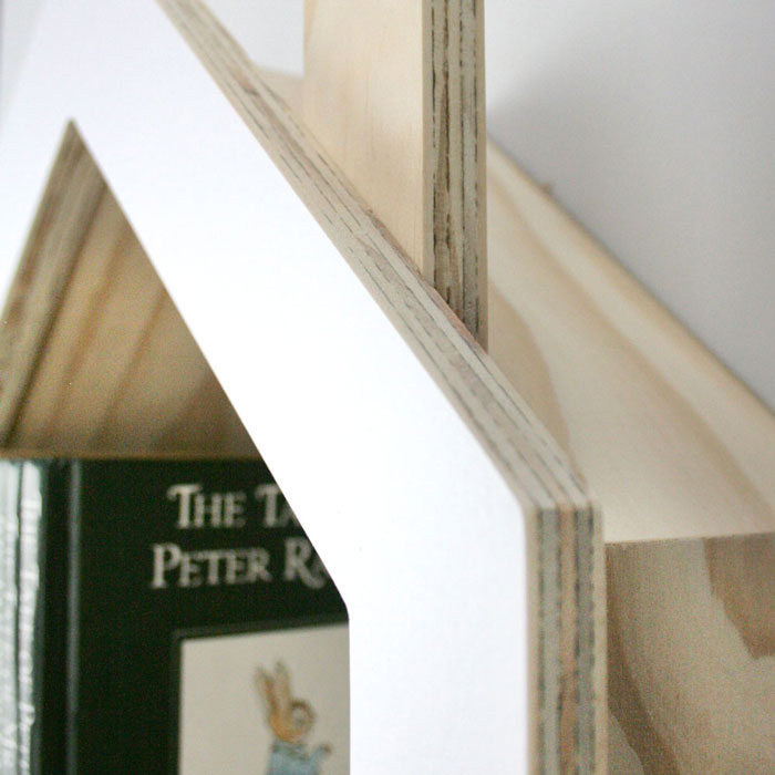 House shaped nursery shelf in white side aspect detail.