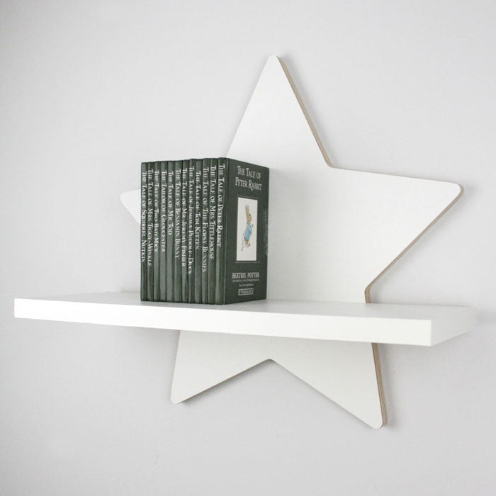 Star shaped nursery shelf in white side aspect detail.