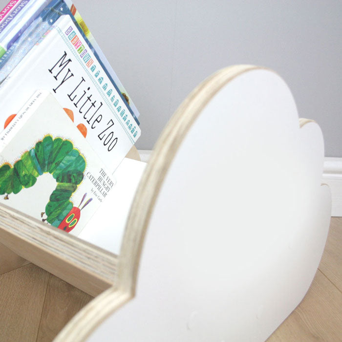 Cloud shaped book rack with books.