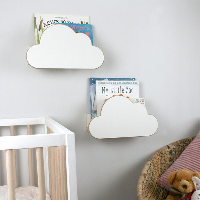 Two cloud shaped nursery wall mounted book shelf in white.